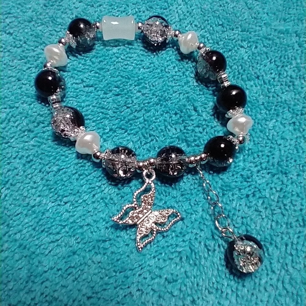 Silvertone crystal butterfly black clear crack glass faux pearl stretch bracelet